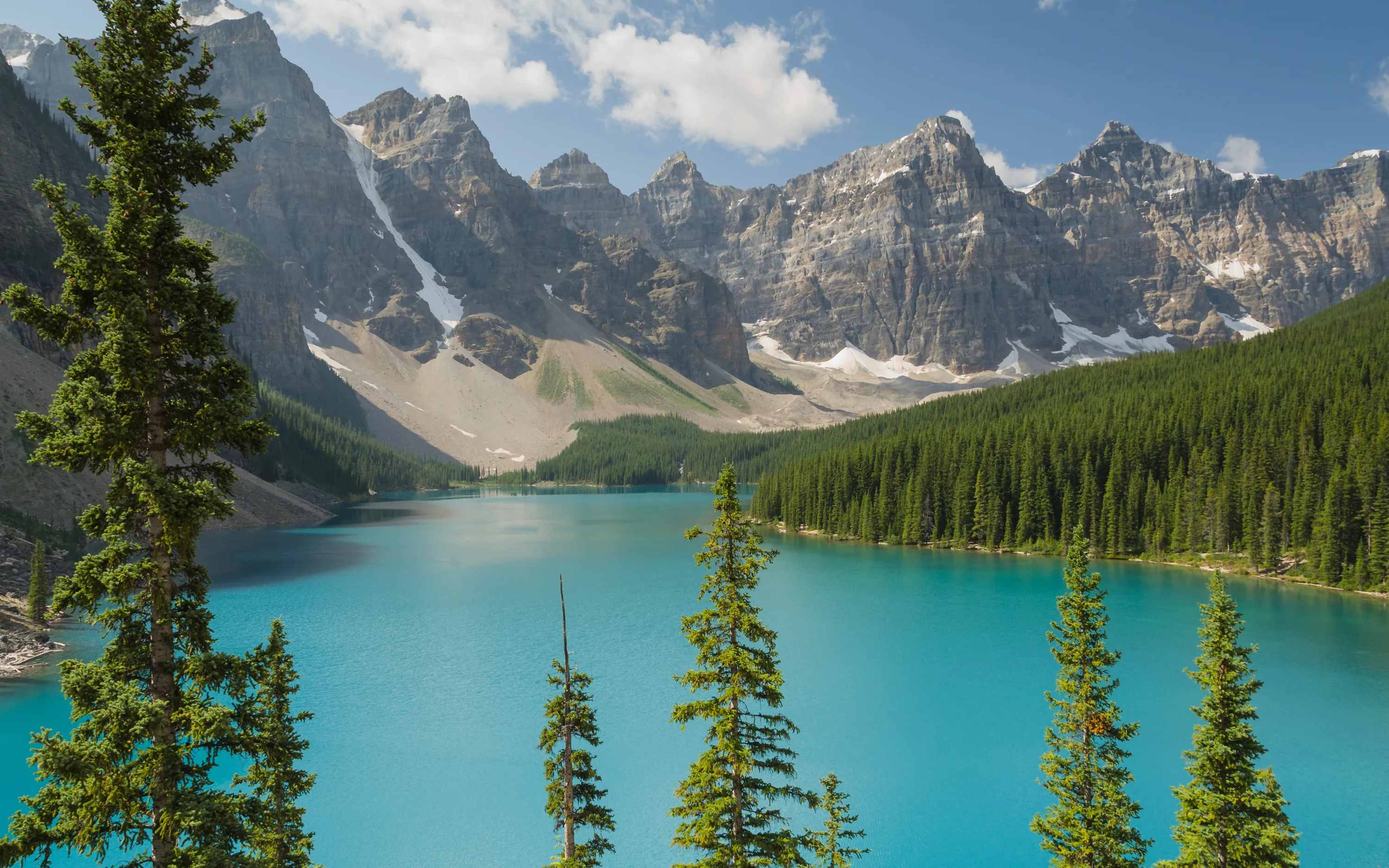 Moraine Lake's blue water below the Valley of the Ten Peaks in Banff National Park