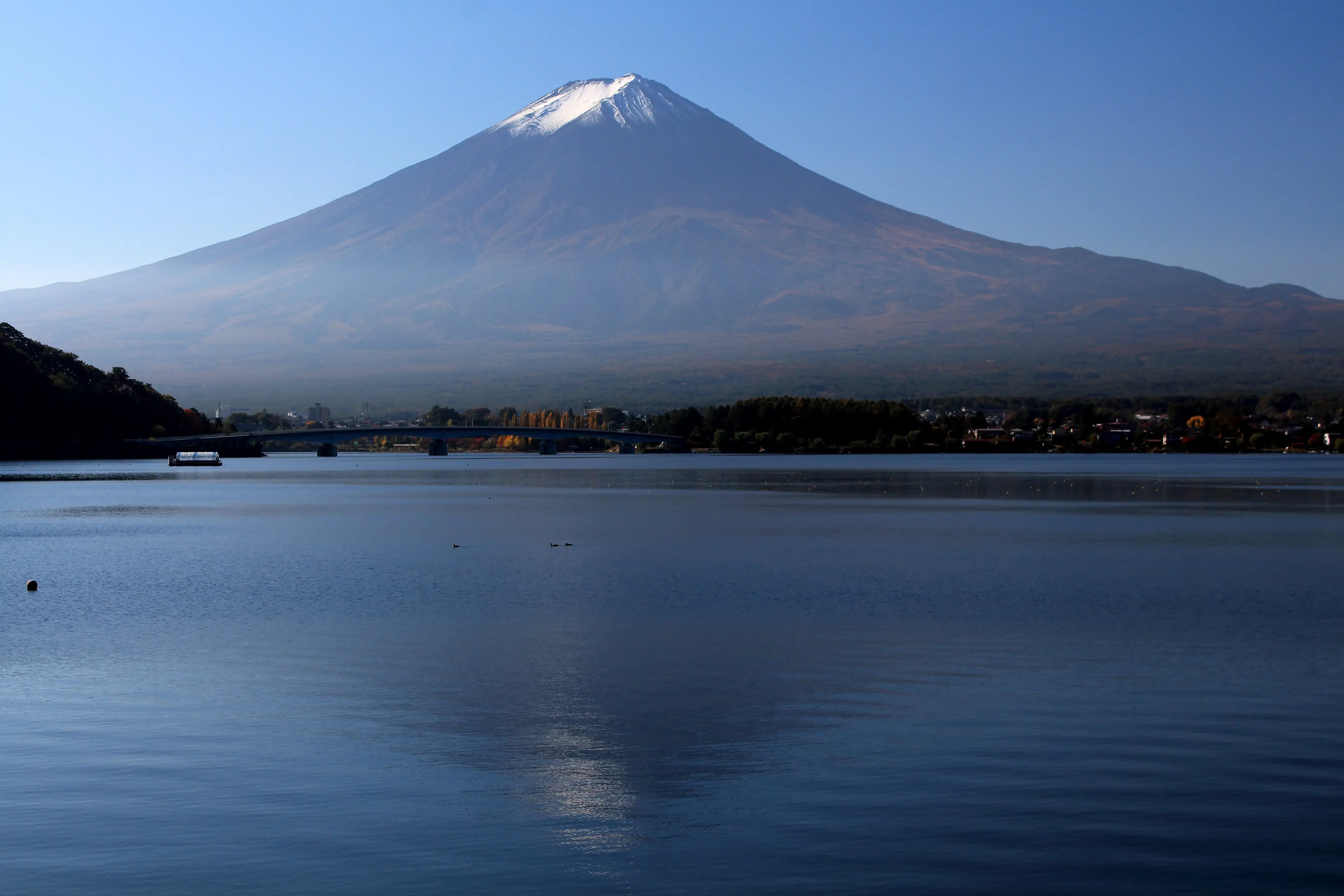 Snow-capped Mount Fuji rising above Lake Kawaguchi