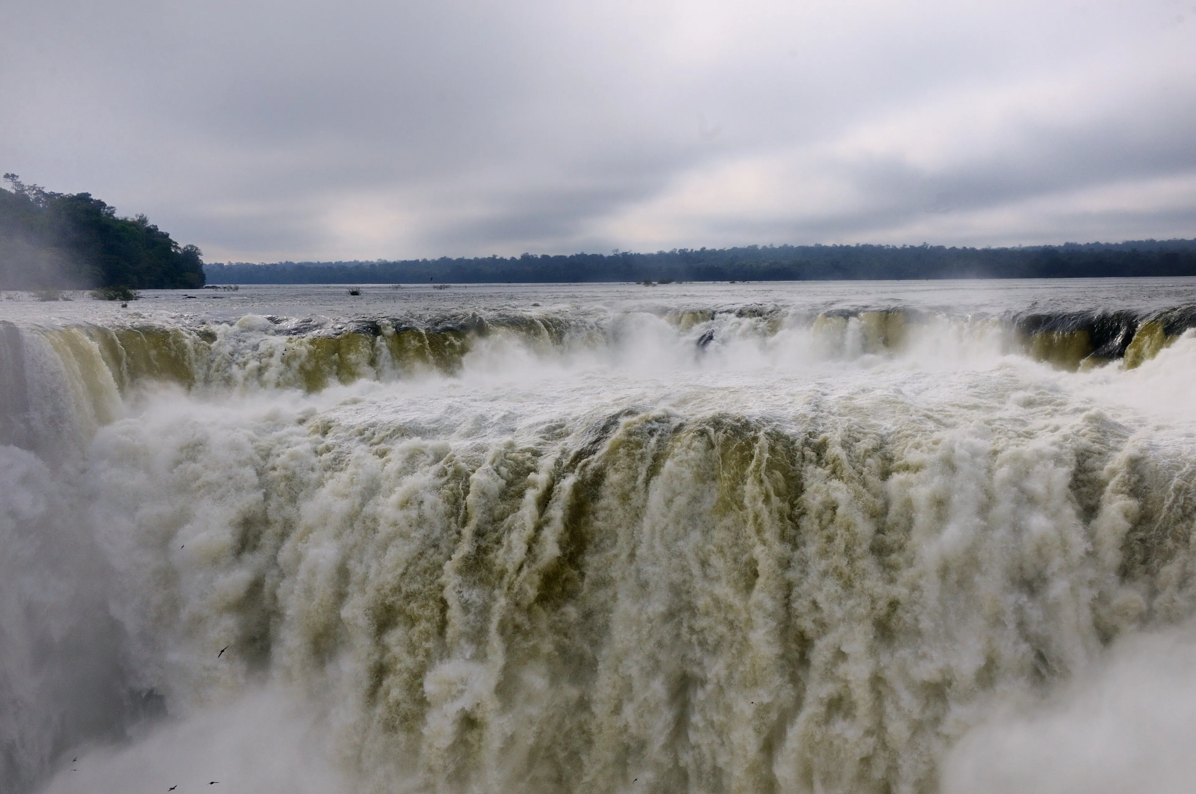 Water thundering into the Devil's Throat at Iguazu Falls, seen from the Argentine side