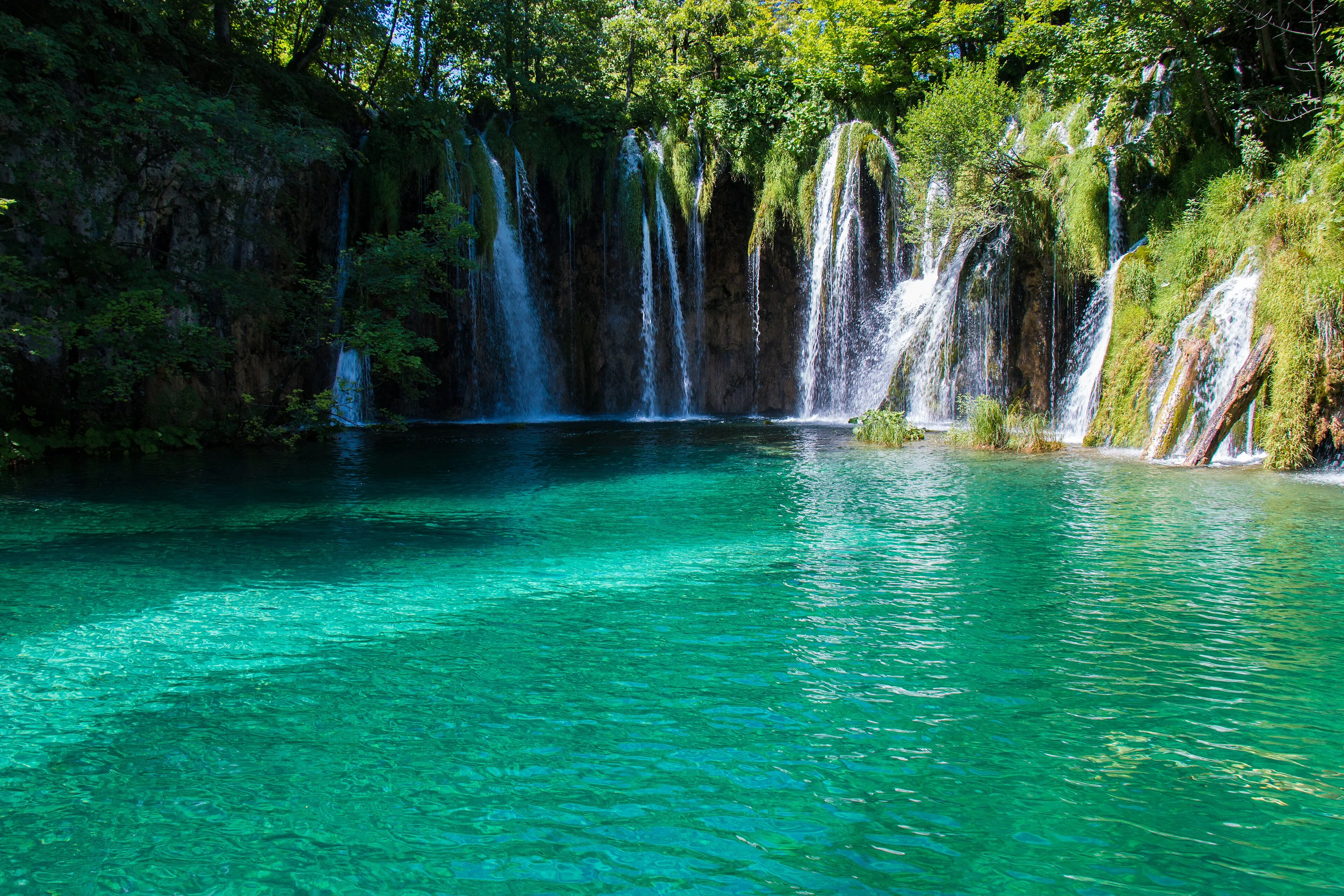 Turquoise lakes and cascades separated by tufa barriers in Plitvice Lakes National Park