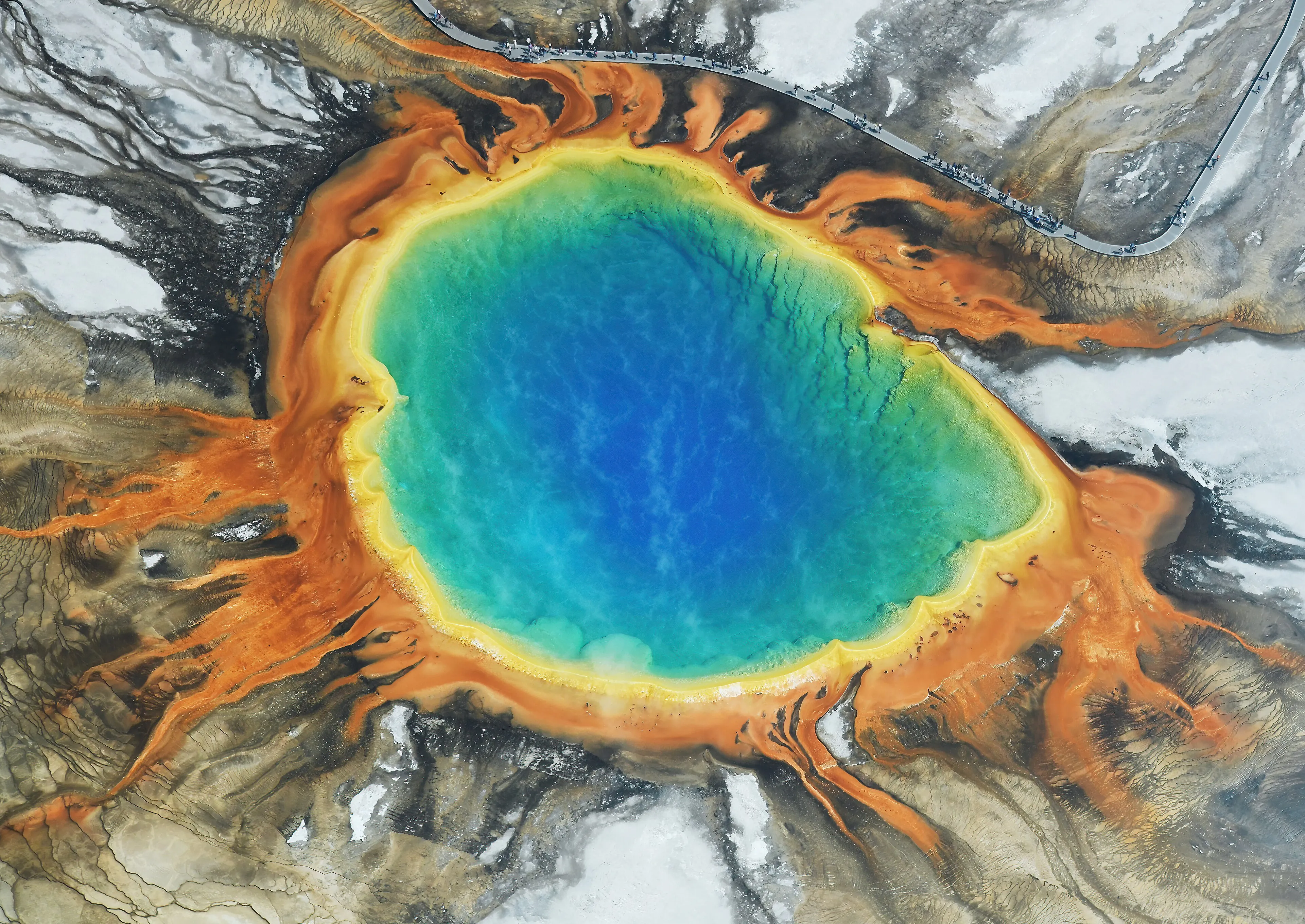 Aerial view of Grand Prismatic Spring with its blue centre and orange bacterial mats